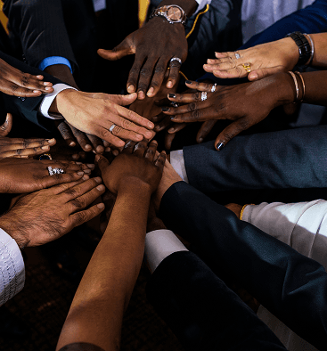 business people putting their hands together