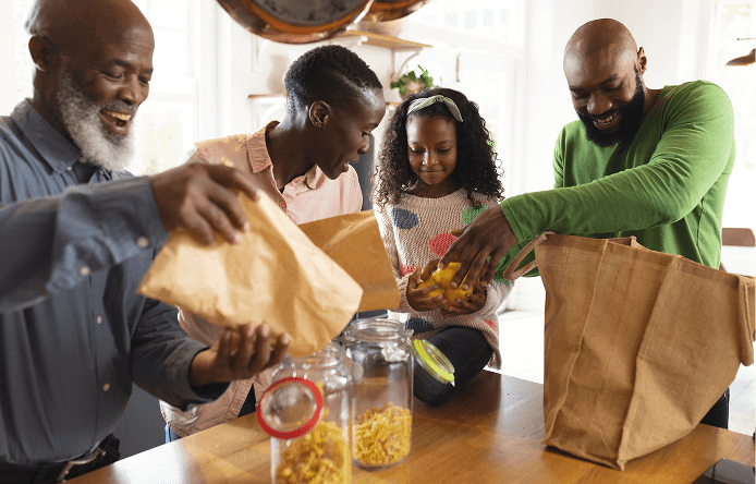 happy african american family unpacking shopping bags